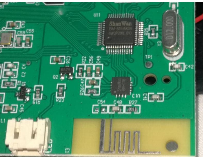 Close-up of the ShanWan radio chip and the printed PCB antenna