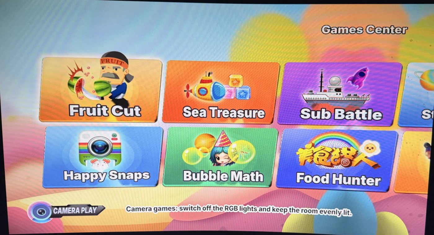 Games Center with the Camera Play notice in English